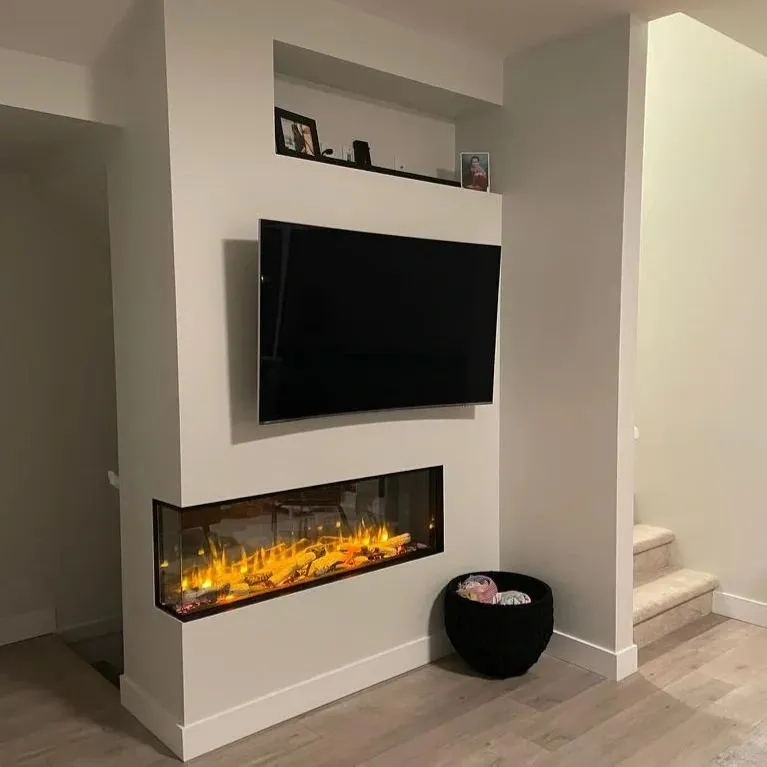 A fireplace with a television mounted on it