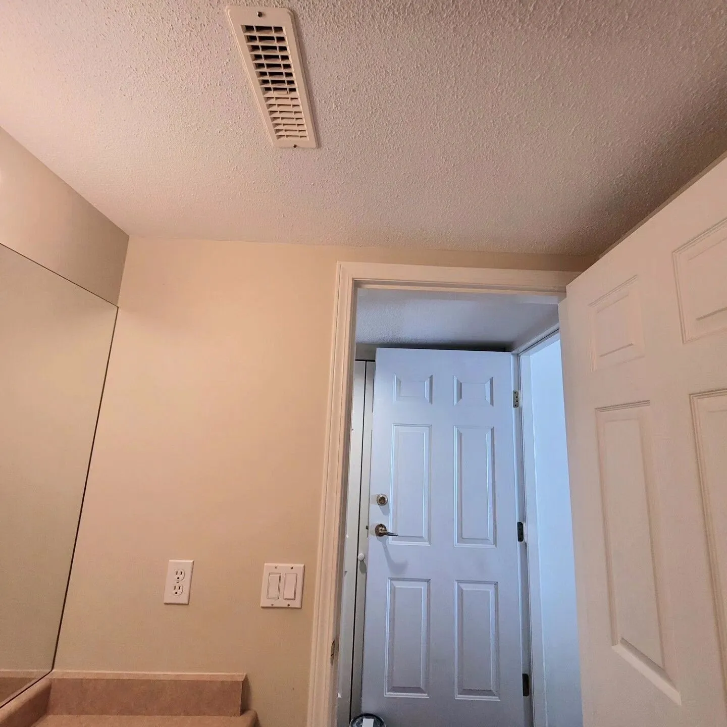 A door open to the inside of a room.